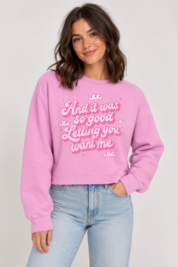 Model wearing the Letting You Want Me Cropped Sweatshirt in Pink