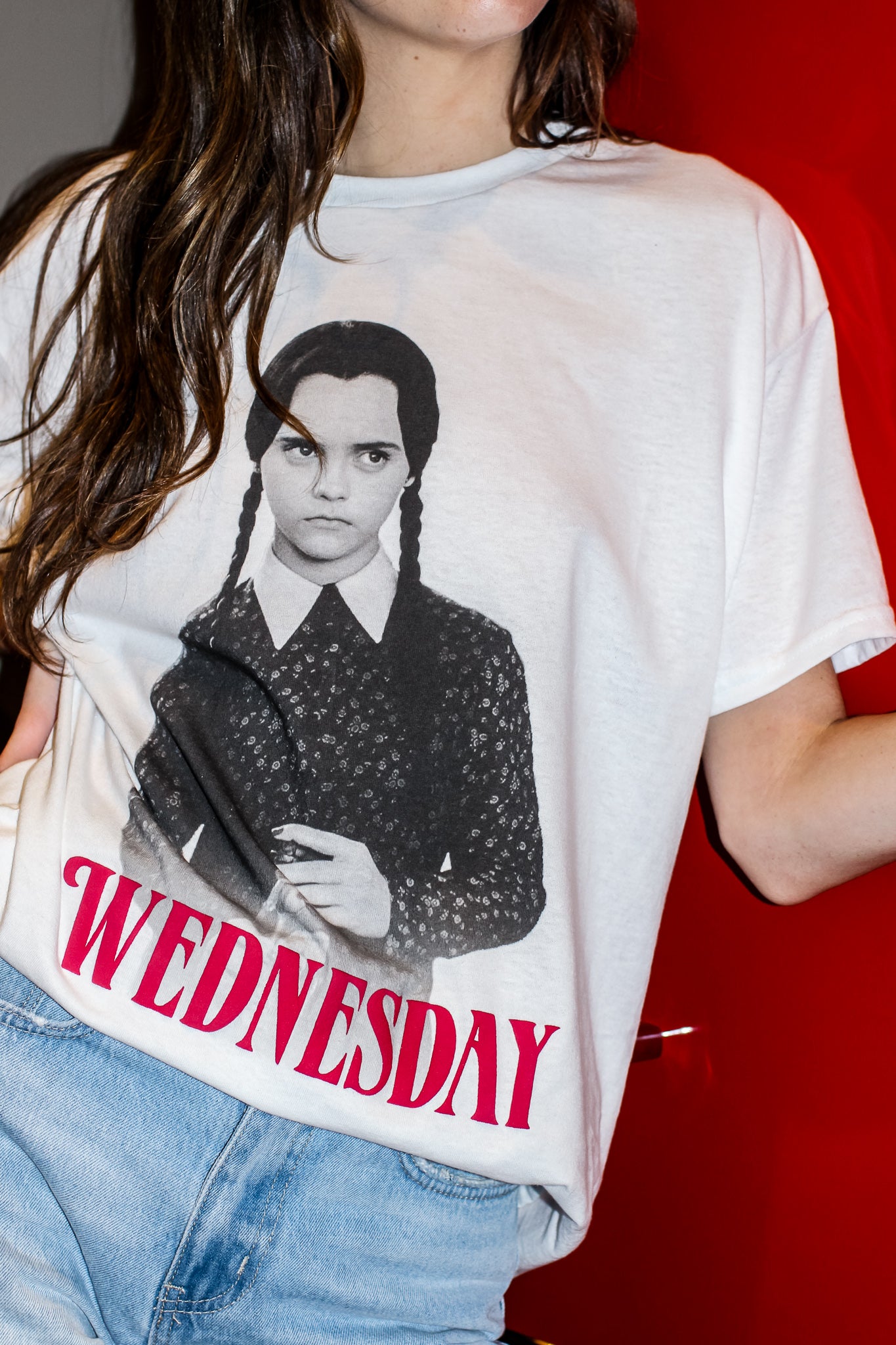 Channel your inner Wednesday with this perfectly pale tee made for lovers of all things dark and deadpan. Printed on a soft, oversized white Comfort Colors tee, this shirt brings spooky season vibes all year long. Pair it with black denim, combat boots, and a stare that could kill.

Whether you're a fan of the Netflix series, the OG Addams Family, or just living your best soft goth life—this tee is your new creepy cute go-to.