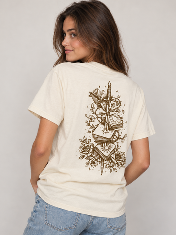 Model wearing the And Still She Rises tee, back view, fae-court romantasy book merch by Girl Tribe Co.