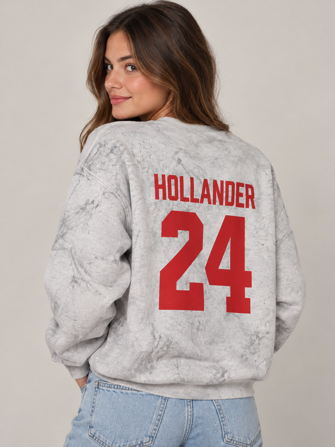 Model wearing the Hollander 24 Sweatshirt in Smoke Grey, back view, rivals-to-lovers hockey romance merch by Girl Tribe Co.