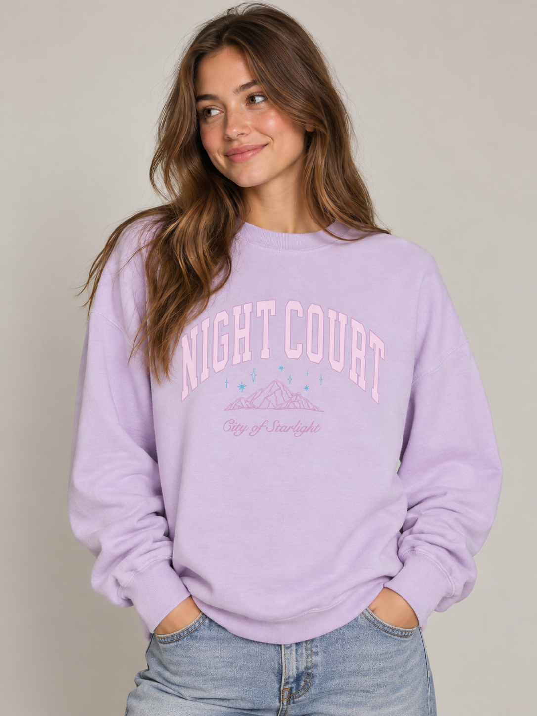 Model wearing the Night Court Sweatshirt in Lavender, fae-court romantasy book merch by Girl Tribe Co.