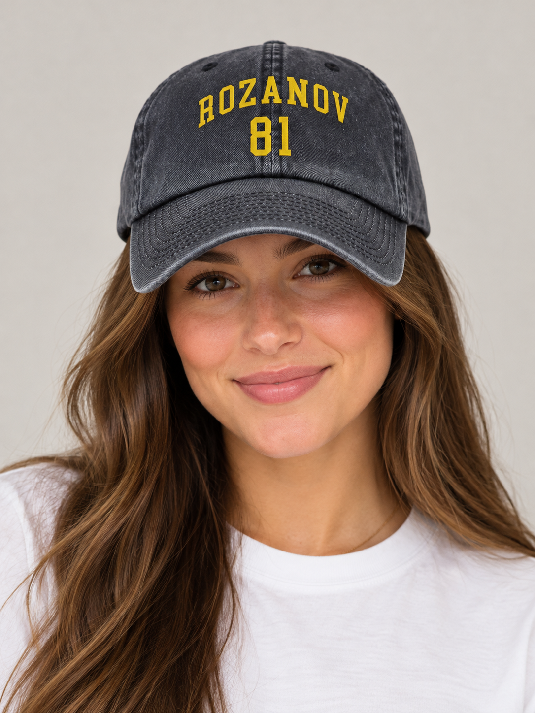 Model wearing the Rozanov 81 Dad Hat, rivals-to-lovers hockey romance merch by Girl Tribe Co.