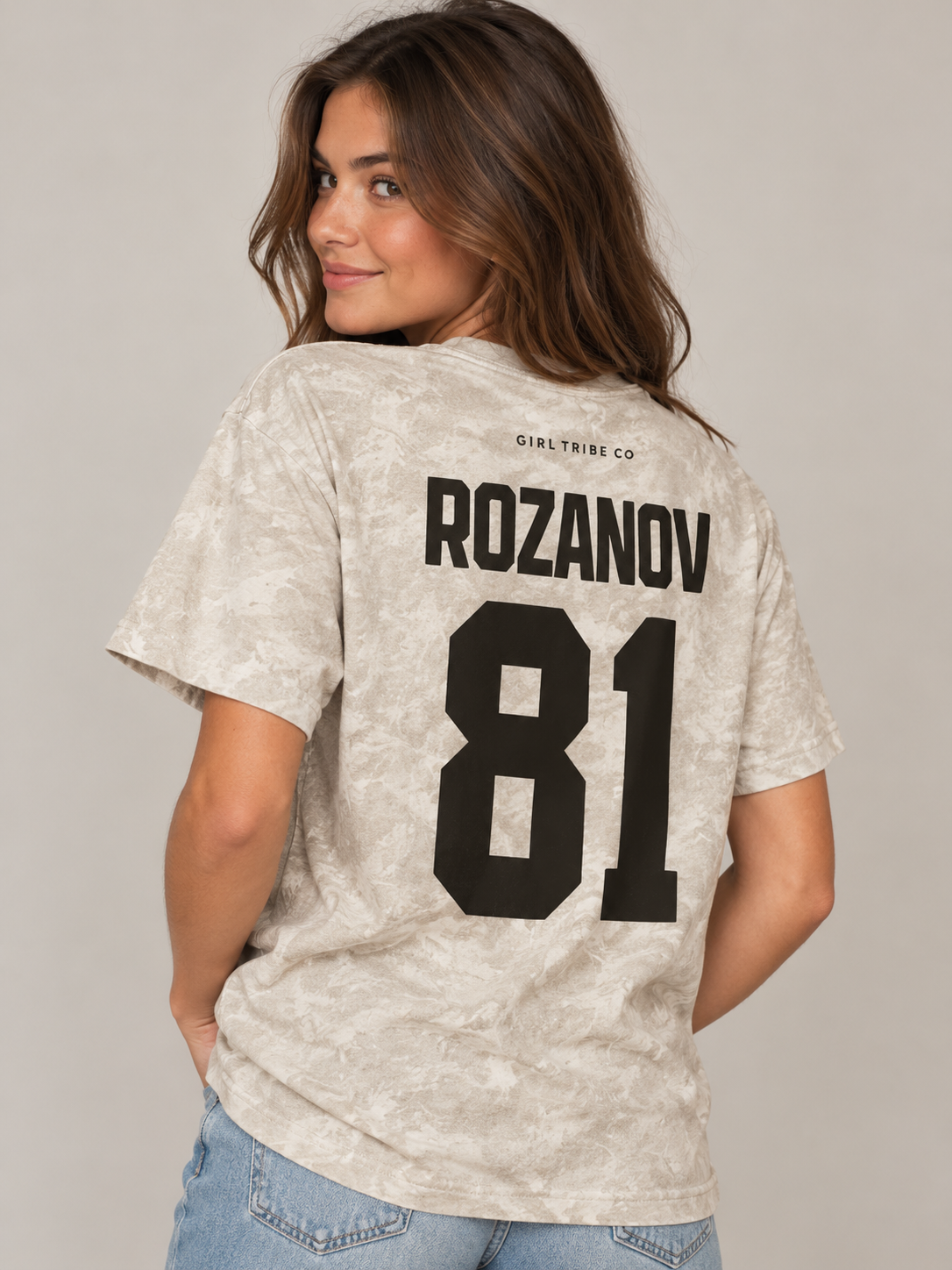 Model wearing the Rozanov 81 Every Day Tee in Camo, back view, rivals-to-lovers hockey romance merch by Girl Tribe Co.