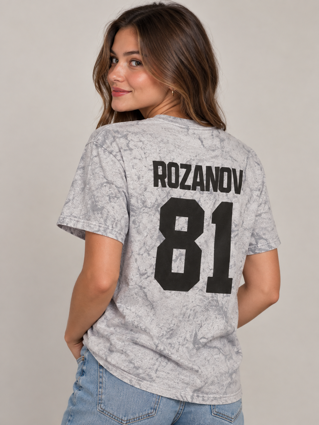 Model wearing the Rozanov 81 Every Day Tee in Smoke Gray, back view, rivals-to-lovers hockey romance merch by Girl Tribe Co.