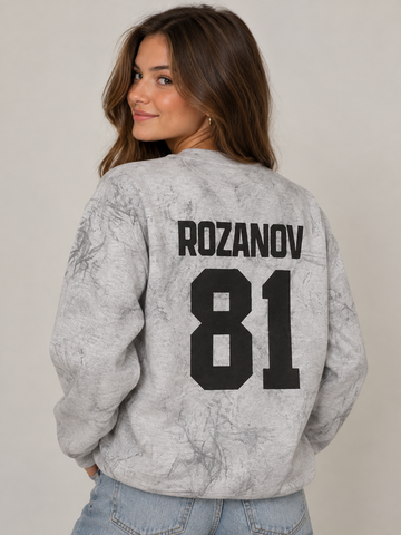 Model wearing the Rozanov 81 Sweatshirt in Smoke Grey, back view, rivals-to-lovers hockey romance merch by Girl Tribe Co.