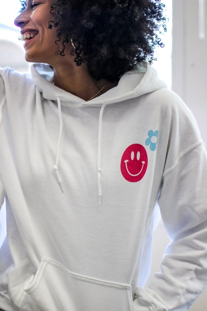 White hoodie with the phrase "I hope you have a good day" in multiple fun colors